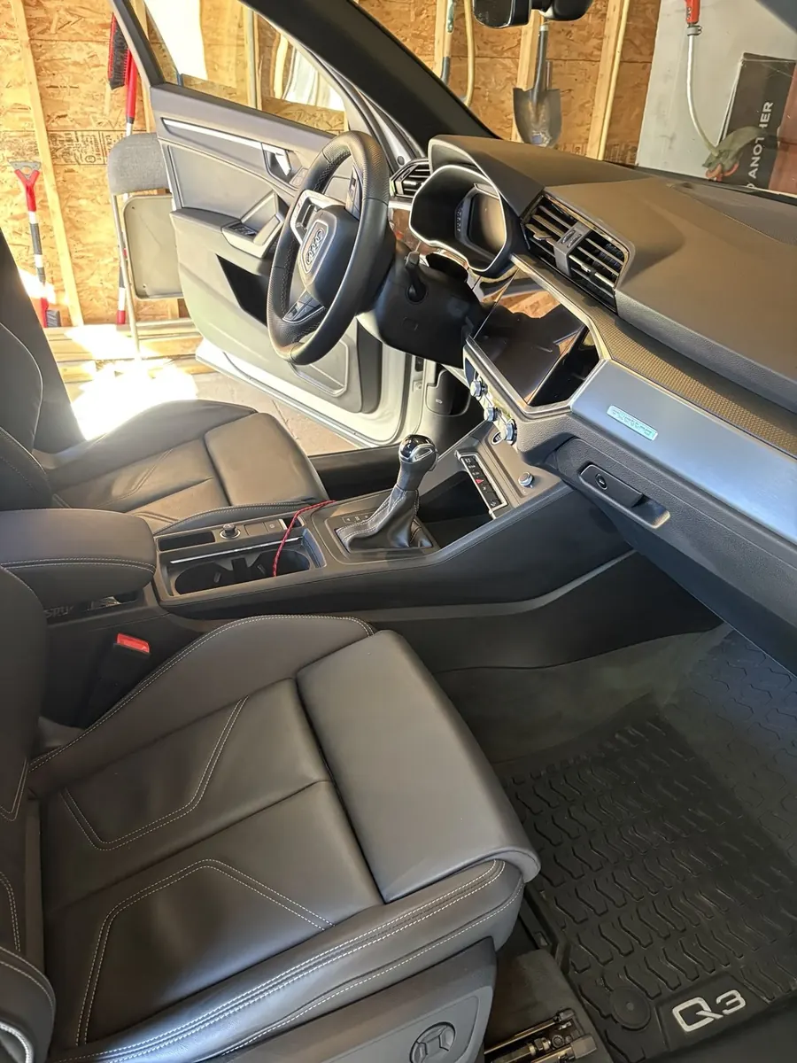 Vehicle interior dashboard and seats after a Grand Slam interior detail